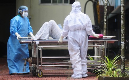 Health workers wear protective gear as they move a patient with symptoms of Nipah virus to an isolation ward in Kozhikode, Kerala, India, on September 16, 2023. India has seen a small outbreak of the virus in the state of West Bengal in recent weeks. Photo: AFP