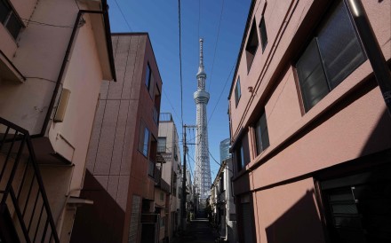 Tokyo Skytree is pictured between buildings in a residential area of Tokyo on February 20, 2025. Photo: AFP