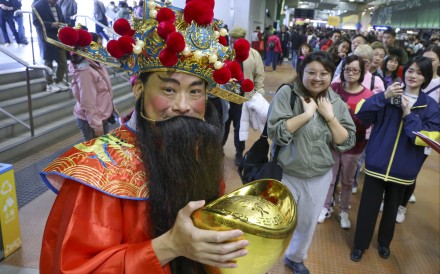 A performer dressed as the God of Wealth for Chinese New Year Raceday at Sha Tin Racecourse in 2024. Photo: Dickson Lee
