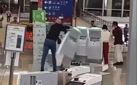 A foreign national has been arrested at Hong Kong International Airport after a video showed him damaging self-check-in kiosks. Photo: Facebook/@ hkcaml