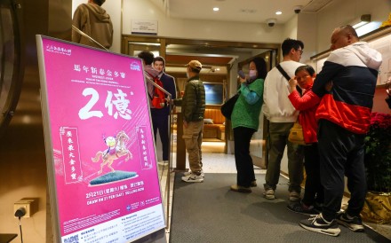 People line up for Mark Six tickets at the Stanley Street Jockey Club branch in Central.  Photo: Dickson Lee