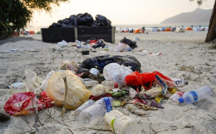 Overflowing bins and litter on the beach in the scenic district of Sai Kung after the number of camping tents exceeded the designed capacity by over 10 times on the second day of the Chinese New Year. Photo:Greenpeace