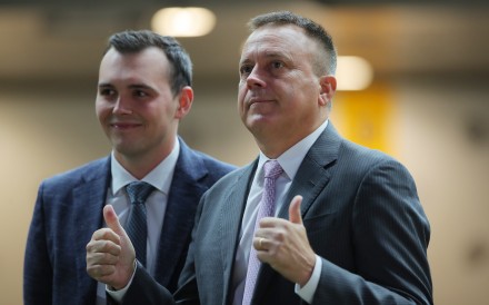 Caspar Fownes (right) and son Ronan celebrate the stable’s latest treble at the Valley. Photos: Kenneth Chan