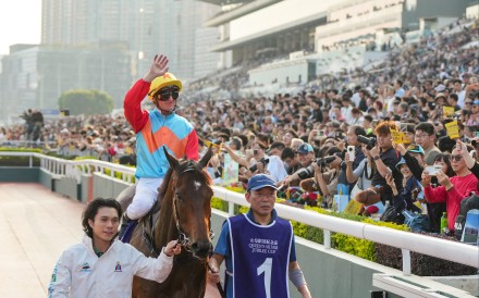 Zac Purton celebrates a record-breaking 18 consecutive wins aboard Ka Ying Rising in the Queen’s Silver Jubilee Cup. Photo: Sam Tsang