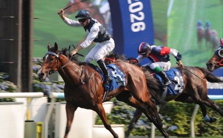 Hugh Bowman salutes after booting home Invincible Ibis in the 2026 Hong Kong Derby. Photos: Kenneth Chan