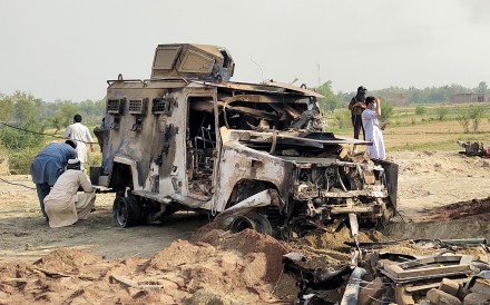 A destroyed police armoured at the site of a suicide attack in Bannu district, Khyber Pakhtunkhwa province, Pakistan, on Sunday. Photo: Xinhua