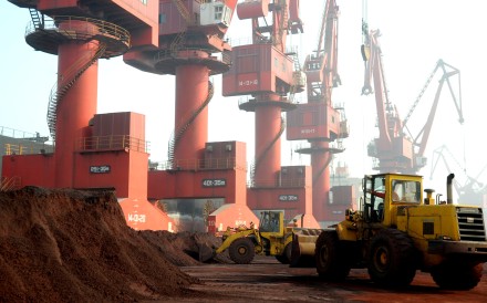 Workers transport soil containing rare earth elements for export at a port in China’s eastern Jiangsu province. Photo: Reuters