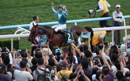 Romantic Warrior and James McDonald return after winning the Group One QEII Cup at Sha Tin. Photo: Sam Tsang