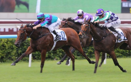 Zac Purton and Rising World (left) race to victory in the Hong Kong Wu Hua General Association Cup Plate at Sha Tin. Photo: Kenneth Chan.