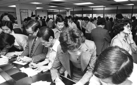 People fill in Mark Six lottery tickets in a betting shop in 1977. Photo: SCMP Archives