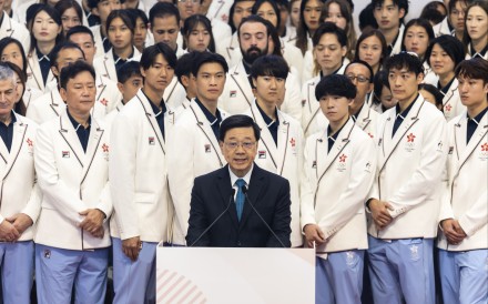Hong Kong Chief Executive John Lee with members of the Hong Kong delegation at the presentation ceremony. Photo: SF&OC