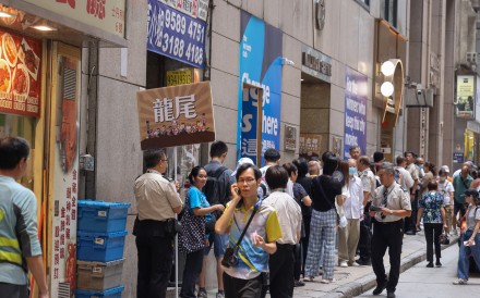 A queue outside the Hong Kong Jockey Club’s betting branch on Stanley Street in Central last Saturday. Nora Tam