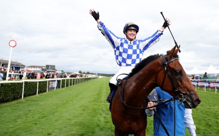Saffie Osborne celebrates her record-breaking St Leger win on Highwayman. Photos: HKJC