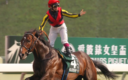 Umberto Rispoli wins the QE II Cup (2,000m) on Rulership in 2012. Photos: Kenneth Chan