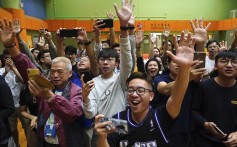 Supporters of pro-democracy candidate Angus Wong celebrate his victory. Photo: AP