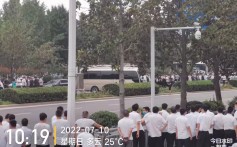 White-shirted group attacks protesters at China banking scandal demonstration