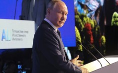 Russian President Vladimir Putin speaks as he visits an artificial intelligence conference in Moscow on Friday. Photo: Sputnik via AP