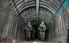 Israeli soldiers the newly discovered Hamas tunnel, near the Erez border crossing in Gaza. Photo: AP