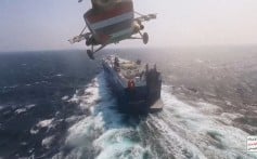 A Houthi forces helicopter approaching the Galaxy Leader in the Red Sea in November. Photo: Houthi Media Centre via AP