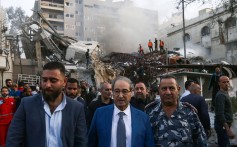 Syrian Foreign Minister Faisal Miqdad, pictured at the site of the attack, which he described as “henious”. Photo: AFP