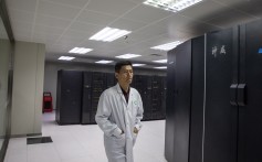 An employee walks next to supercomputers at The National Supercomputer Centre in Jinan, Shandong province. Photo: EPA-EFE