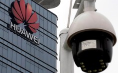 A surveillance camera is seen in front of the Huawei logo outside its factory campus in Dongguan, China, in March. Photo: Reuters