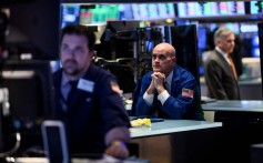 A trader is seen ahead of the closing bell on the floor of the New York Stock Exchange on March 18, 2019 in New York. Photo: AFP