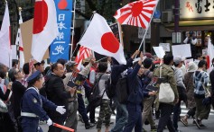 People protest in Tokyo against Japanese PM Shinzo Abe’s legislation clearing the way for more foreign workers. Photo: Bloomberg