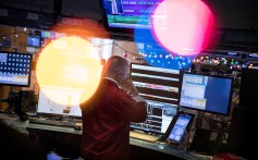 A trader works on the floor of the New York Stock Exchange. The US bond market is pricing on the assumption the US-China trade war will deliver a deflationary bust. Photo: Bloomberg