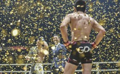 Shinya Aoki looks on as Christian Lee celebrates his lightweight title victory in Singapore. Photos: One Championship