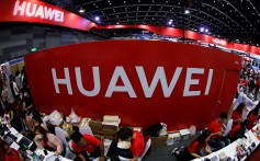 Workers sit a the Huawei stand at the Mobile Expo in Bangkok, Thailand May 31, 2019. Photo: Reuters