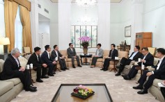 Chief Executive Carrie Lam, flanked by Commissioner of Police Stephen Lo (left), and Secretary for Security John Lee (right), meets the chairmen and vice-chairmen of four police unions at Government House to offer their members her full support. Photo: Handout