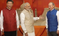 Chinese President Xi Jinping with Indian Prime Minister Narendra Modi and Russian President Vladimir Putin at a BRICS summit in Goa, India in 2016. Photo: AP