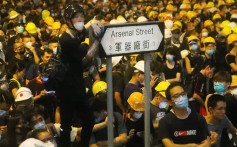 Protesters wear their trademark yellow helmets as they gather outside police headquarters in Wan Chai on June 22. Photo: Edmond So