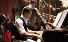 Donnie Yen playing the piano in Legend of the Fist: The Return of Chen Zhen (2010), directed by Andrew Lau (back).