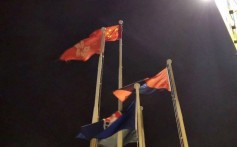 The Chinese national flag flies over Tsim Sha Tsui in Hong Kong on Saturday night. Photo: Huanqiu.com