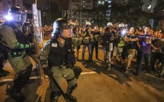 A riot police officer uses pepper spray on protesters on August 3. Clashes between Hong Kong police and protesters have become a regular sight this month. Photo: Felix Wong
