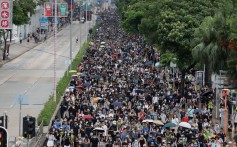 Anti-government protesters march in Sham Shui Po despite a police ban on them doing so. Photo: Felix Wong