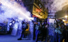 Police fire tear gas at pro-democracy protesters during clashes in Sham Shui Po in Hong Kong on Wednesday. Photo: Reuters