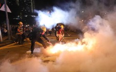 Anti-extradition bill protesters extinguish tear gas canisters during a clash with police on August 3, in Wong Tai Sin, Hong Kong. Picture: Felix Wong