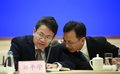 Shenzhen University law professor Zou Pingxue (left) and Zhang Jian, director of Hong Kong and Macau Studies at the Shanghai Institutes of International Studies, offer their assessment of Hong Kong’s crisis in Beijing on Thursday. Photo: EPA-EFE