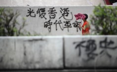The protesters’ rallying cry of “Liberate Hong Kong; revolution of our times” is seen on August 6 spray-painted on a wall in Mong Kok. Photo: Winson Wong