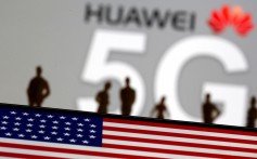 Small toy figures are seen in front of a Huawei and 5G network logo in this illustration picture taken in March. Photo: Reuters