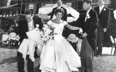 Jackie Kennedy in the wedding gown designed by Ann Lowe on September 12, 1953. Groom John F. Kennedy is second from right. Photo: Toni Frisell / John F. Kennedy Presidential Library and Museum