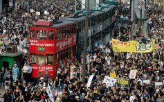 Trams are stranded as half a million protesters take to the streets in Hong Kong on July 1, 2003, to protest against the controversial Article 23 national security bill. Photo: AFP