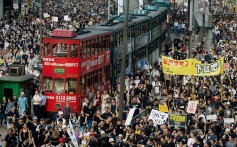Trams are stranded as half a million protesters take to the streets in Hong Kong on July 1, 2003, to protest against the controversial Article 23 national security bill. Photo: AFP