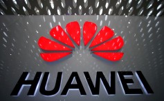 FILE PHOTO: A Huawei company logo is pictured at the Shenzhen International Airport in Shenzhen, Guangdong province, China July 22, 2019. REUTERS/Aly Song/File Photo