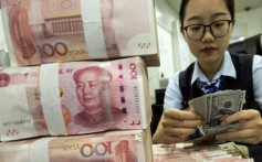 A bank employee in Haian, Jiangsu province, counts US dollar banknotes next to a stack of Chinese yuan notes. By accusing China of currency manipulation, the US is ignoring reality and applying double standards. Photo: Chinatopix via AP