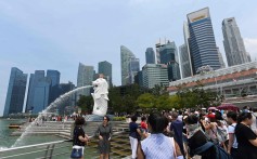 Visitors at the Merlion park in Singapore on August 13, 2019. Photo: AFP