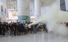 Anti-government protesters use fire extinguisher in Tsing Yi Station on 22 September 2019. Photo: Dickson Lee